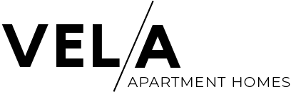 A logo for Vela Apartment Homes.